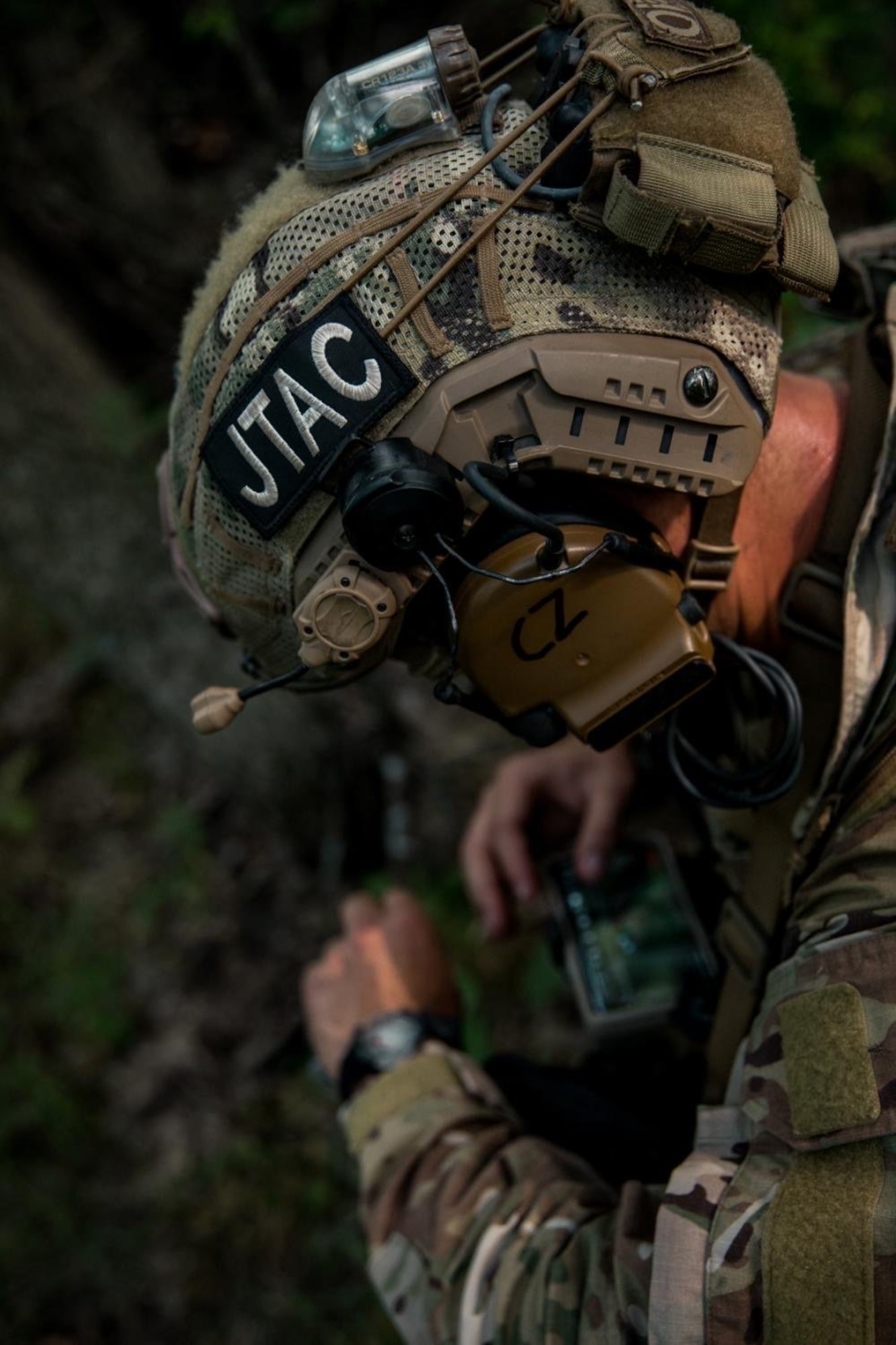 A Tactical Air Control Party (TACP) Airman from the 10th Air Support Operations Squadron conducts an area reconnaissance mission as part of joint exercise Gunslinger 22 at Fort Riley Army Post, Kansas, June 24, 2022. Gunslinger 22 integrated U.S. Air Force TACP precision strike team capabilities with U.S. Marine Corps expeditionary air base operations in order to test dynamic force employment options for the supported commander. (Courtesy photo)