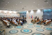 Col. Douglas Copeland, outgoing Project Manager for Soldier Maneuver and Precision Targeting (PM SMPT), addresses the audience turns over the organizational charter to Brig. Gen. Christopher Schneider, Program Executive Officer (PEO) Soldier, during a relinquishment of charter ceremony held on Fort Belvoir, July 14. The ceremony marked the disestablishment of PM SMPT after more than 20 years of providing Soldiers with capabilities designed to enhance lethality, mobility and survivability. (U.S. Army Photo by Jason Amadi, PEO Soldier Public Affairs)