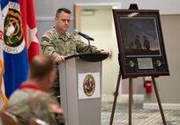 Brig. Gen. Christopher Schneider, Program Executive Officer (PEO) Soldier, addresses Col. Douglas Copeland, outgoing Project Manager for Soldier Maneuver and Precision Targeting (PM SMPT), during a relinquishment of charter ceremony held on Fort Belvoir, July 14. The ceremony marked the disestablishment of PM SMPT after more than 20 years of providing Soldiers with capabilities designed to enhance lethality, mobility and survivability. (U.S. Army Photo by Jason Amadi, PEO Soldier Public Affairs)