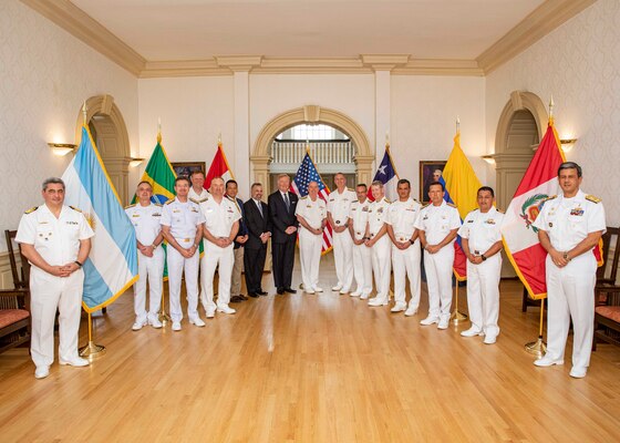 Participants of the inaugural Submarine Conference of the Americas (SCOTA) pose for a photo onboard Naval Station Norfolk, July 26, 2022.