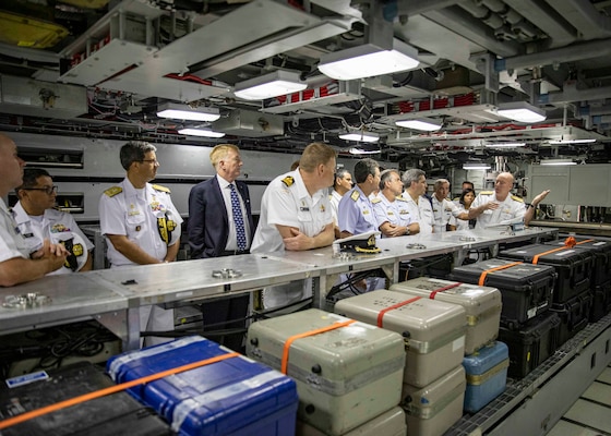 Vice Adm. William Houston, commander, Submarine Forces, right, speaks with participants of the inaugural Submarine Conference of the Americas (SCOTA) during a tour of the Virginia-class fast-attack submarine USS Montana (SSN 794) onboard Naval Station Norfolk, July 26, 2022.