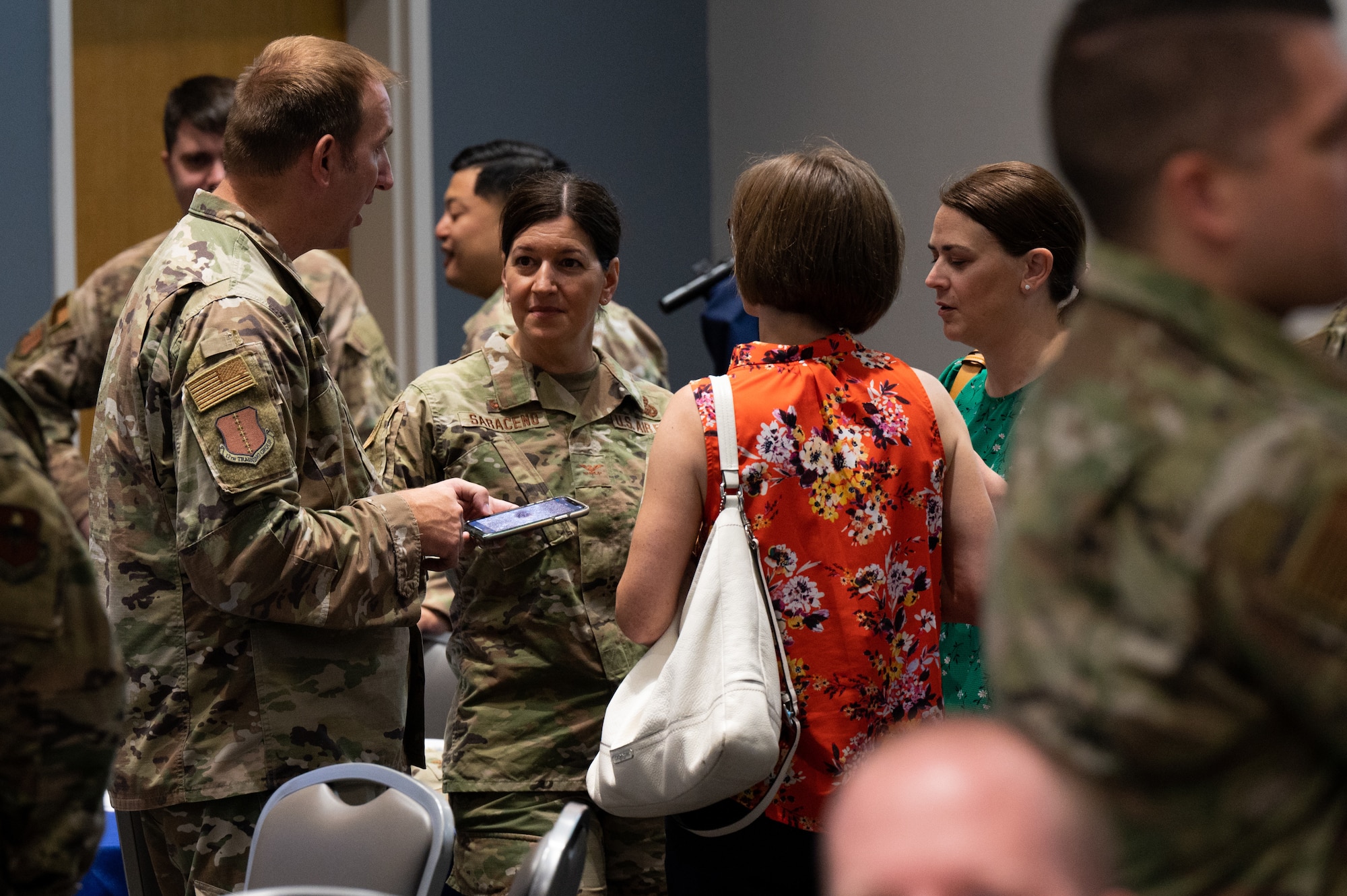 U.S. Air Force Col. Jason Kulcher, 17th Training Wing commander, speaks with Col. Jennifer Saraceno, 517th Training Group commander, and 17th Training Wing key spouses during the Senior Leadership Summit at the Powell Event Center, Goodfellow Air Force Base, Texas, July 27, 2022. The summit gave commanders, senior enlisted leaders, and their spouses an opportunity to meet and immerse themselves in the 17th TRW culture. (U.S. Air Force photo by Senior Airman Michael Bowman)