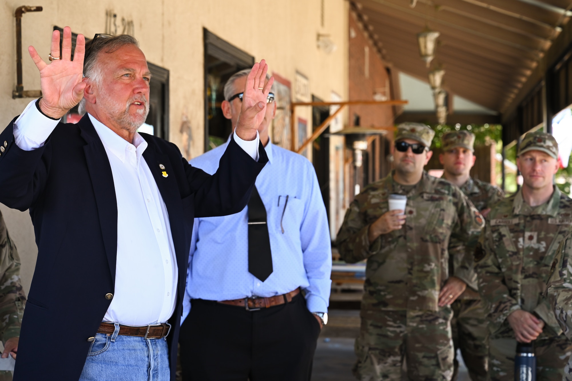 Walt Koenig, president and Chief Executive Officer of the San Angelo Chamber of Commerce, gives a tour of the downtown area to new 17th Training Wing senior leaders, San Angelo, Texas, July 26, 2022. San Angelo is the only community to be awarded the Altus Trophy three times, recognizing the Air Force community that provides the finest support to its Air Education and Training Command unit. (U.S. Air Force photo by Senior Airman Michael Bowman)