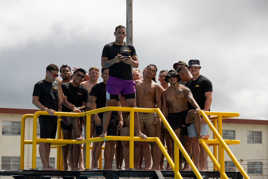 U.S. Marine Corps Instructors of Water Survival and graduates of the Water Survival Advanced course pose for a group photo on Marine Corps Air Station Futenma, Okinawa, Japan, July 22, 2022. WSA is the highest swim qualification that Marines can obtain before becoming Marine Corps Instructors of Water Survival. Throughout the course, students endured aquatic conditioning, endurance swimming, and underwater rescue training.