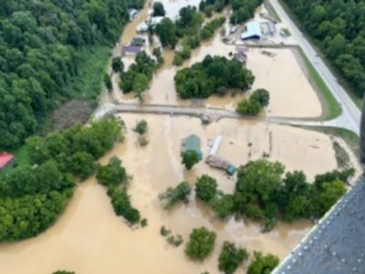 Photo depicting flood damage over Jackson, Kentucky from a West Virginia National Guard UH-60M Blackhawk. Fourteen Soldiers from the WVNG’s Company C, 2-104th General Support Aviation Battalion (MEDEVAC) and Company B, 1-224th Security and Support Aviation Battalion located in Williamstown, West Virginia, flew more than 25 hours July 28, 2022, rescuing over a dozen people and three pets from southeastern Kentucky following catastrophic flash flooding. (courtesy photo)