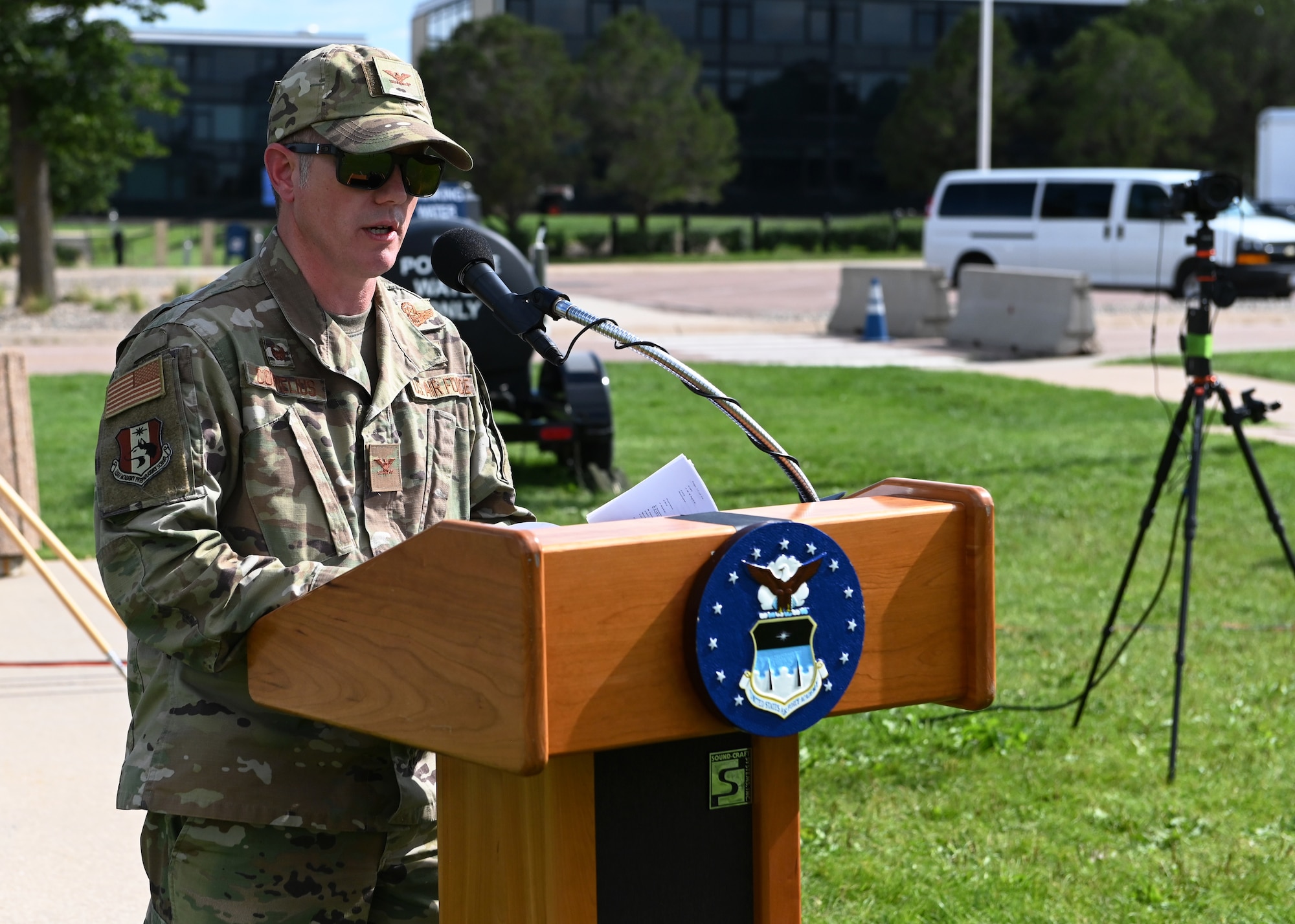 Commander behind podium delivering remarks during Preparatory School parade at U.S. Air Force Academy, Colorado, July 27, 2022.