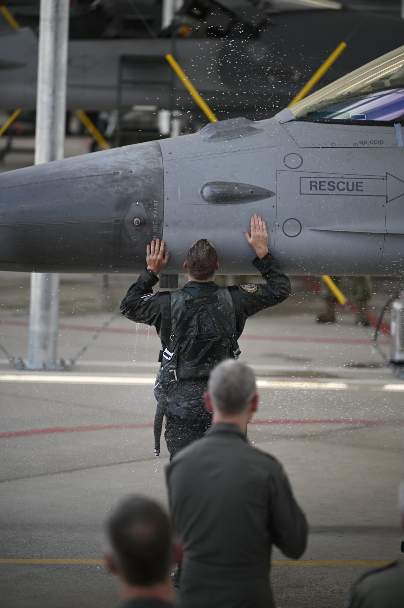 Lt. Col. Joost Luijsterburg, the Royal Netherlands Air Force detachment commander, kisses a Dutch F-16 at the Morris Air National Guard Base after his final flight in the jet. Luijsterburg has already assumed command of the Dutch F-35 detachment at Luke Air Force Base, Arizona, and has been acting as dual commander of both detachments. (U.S. Air National Guard photo by Maj. Angela Walz)