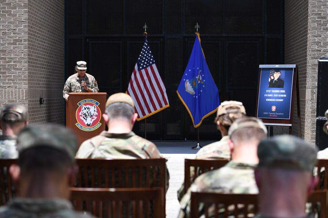 U.S. Air Force Capt. Angel Aquino, 81st Training Wing chaplain, delivers the invocation during a remembrance ceremony for Airman Daniel Germenis outside of Thompson Hall at Keesler Air Force Base, Mississippi, July 28, 2022. Germenis, who was assigned to the 336th Training Squadron, was remembered by members of the 81st Training Group on the one year anniversary of his passing. (U.S. Air Force photo by Kemberly Groue)