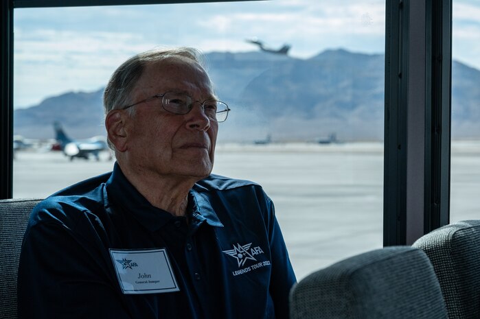 Man sitting on bus looking out the window