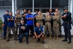 Palauans with the Bureau of Maritime Security, U.S. Marines with Task Force Koa Moana 22, I Marine Expeditionary Force and U.S. Coast Guardsmen with the Maritime Safety and Security Team Honolulu, Fourteenth District, Forces Micronesia/Sector Guam, pose for a photo after a boarding drill in Koror, Republic of Palau, July 26, 2022. U.S. service members are committed to fostering relationships with Palauan law enforcement agencies and supporting an international rules-based order that promotes a mutual vision of a free and open Indo-Pacific.