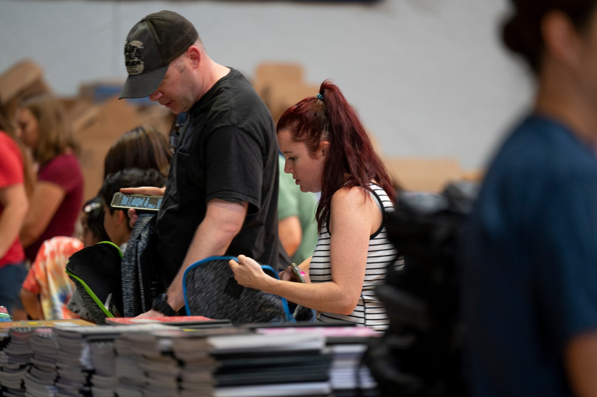 Photo of parents gathering school supplies.