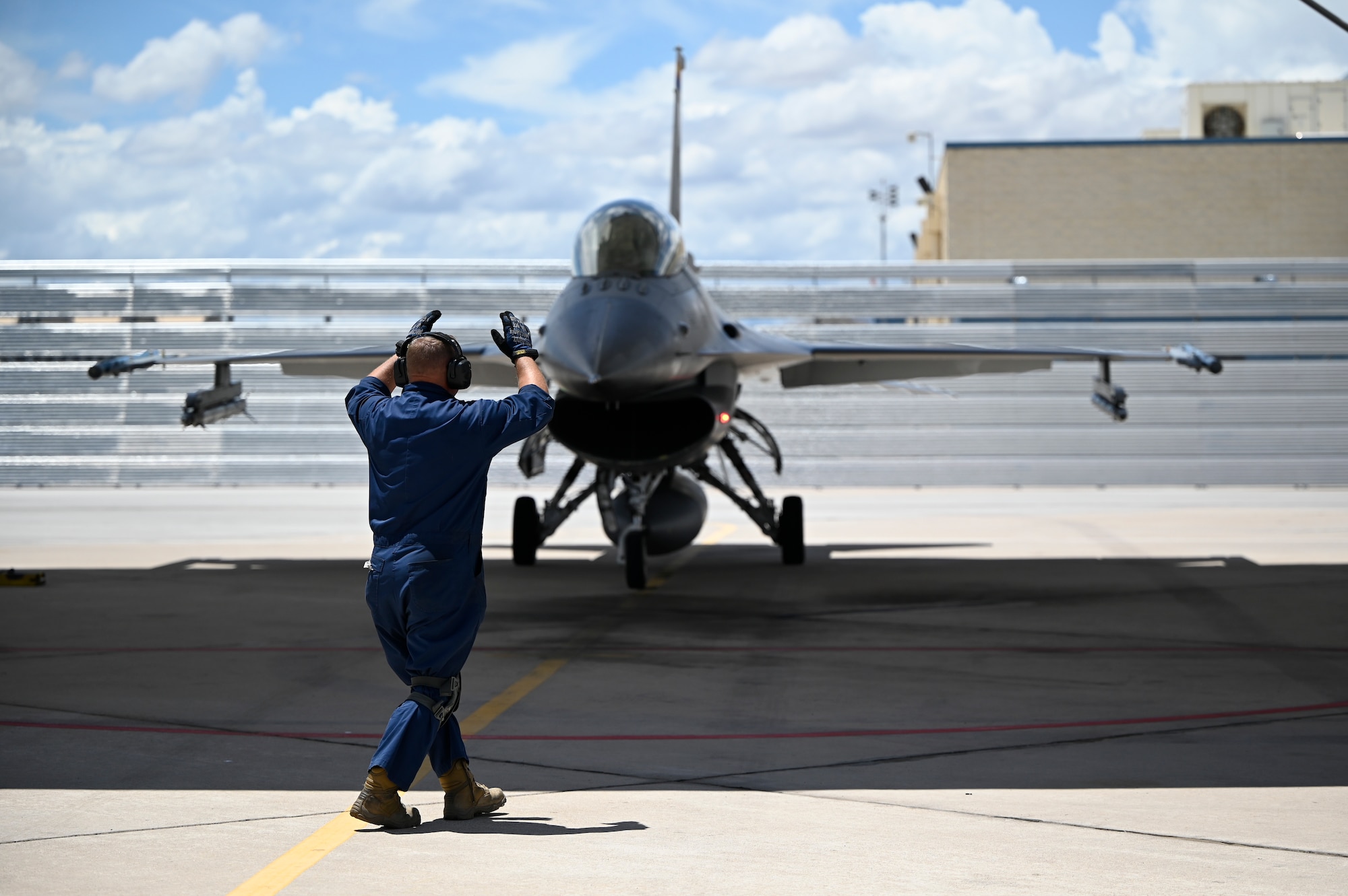 An F-16 crew chief from the 162nd Wing at Morris Air National Guard Base in Tucson parks an F-16 for engine shutdown after its final flight today. The RNLAF has commenced transition from the F-16 to the F-35. (U.S. Air National Guard photo by Maj. Angela Walz)
