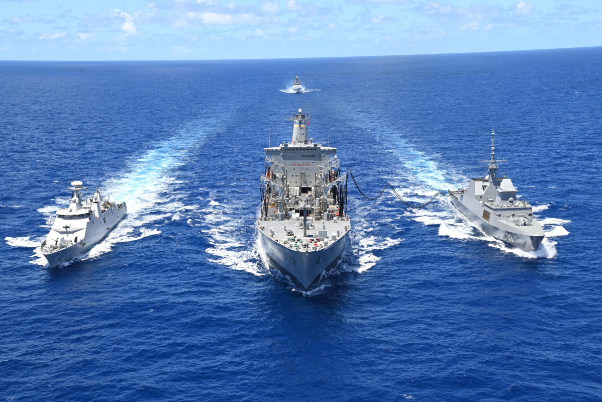 Indonesian Navy frigate KRI I Gusti Ngurah Rai (332), left, Henry J. Kaiser-class fleet replenishment oiler USNS Pecos (T-AO 197), center, Republic of Singapore Navy guided-missile frigate RSS Intrepid (69), right, and Indian Navy frigate INS Satpura (F 48), back, conduct a refueling-at-sea during Rim of the Pacific (RIMPAC) 2022.