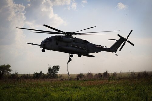 A Tactical Air Control Party (TACP) Airman from the 10th Air Support Operations Squadron conducts fast rope insertion and extraction system (FRIES) training as part of joint exercise Gunslinger 22 at Fort Riley Army Post, Kansas, June 24, 2022. Gunslinger 22 integrated U.S. Air Force TACP precision strike team capabilities with U.S. Marine Corps expeditionary air base operations in order to test dynamic force employment options for the supported commander. (Courtesy photo)