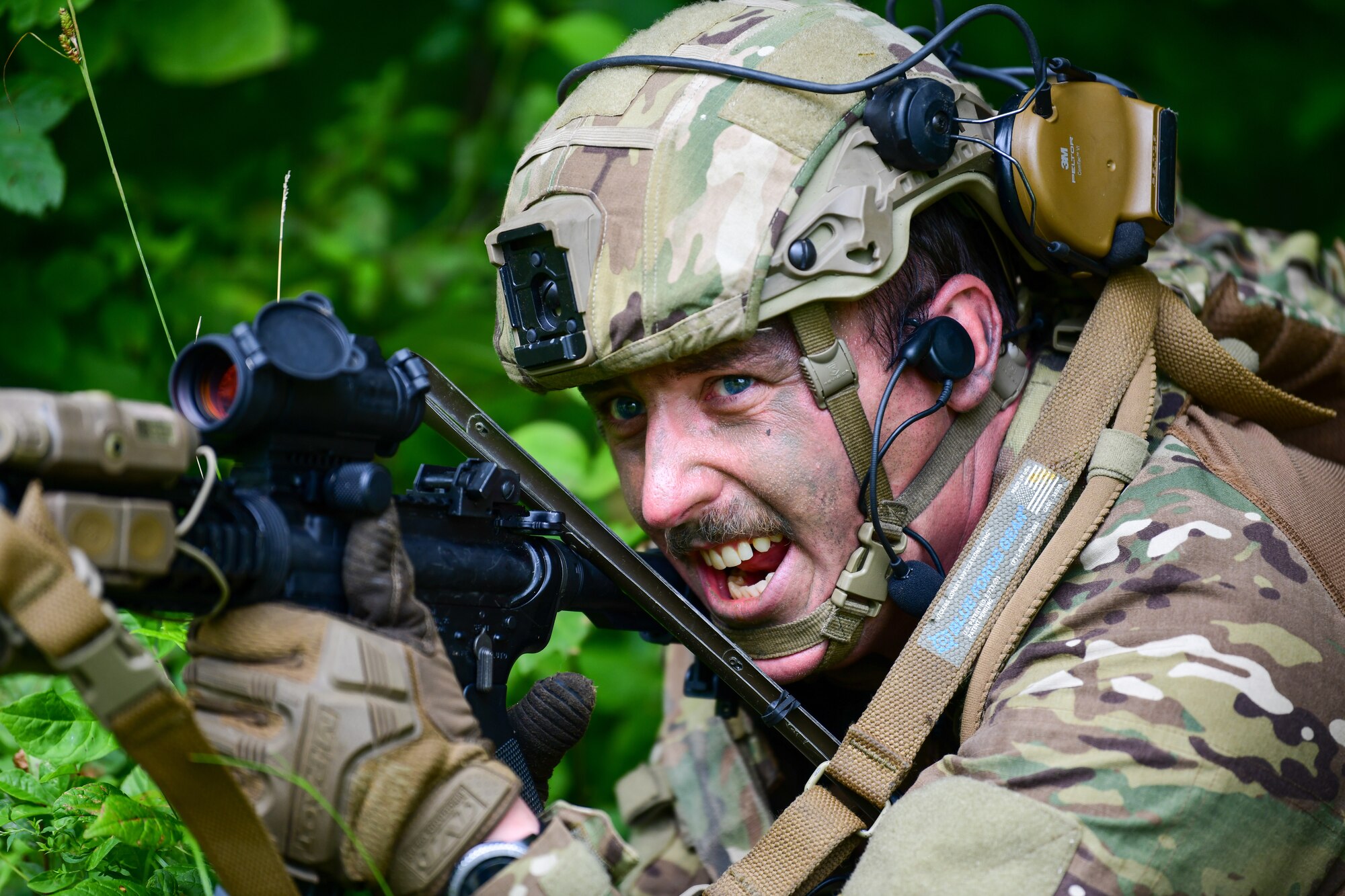 Staff Sgt. Justin Ryan, an Integrated Defense Leadership Course student assigned to the 927th Security Forces Squadron, MacDill Air Force Base, Florida, shouts commands to his squad during an area security operations exercise at Camp James A. Garfield Joint Military Training Center, Ohio, July 27, 2022.