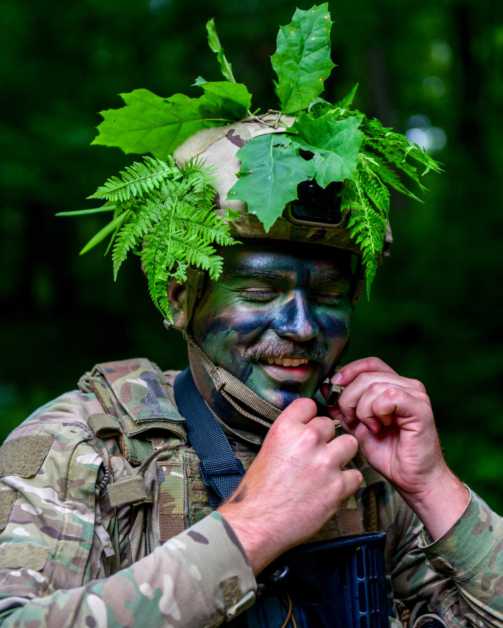 Staff Sgt. Weston Super, an Integrated Defense Leadership Course student assigned to the 927th Security Forces Squadron, MacDill Air Force Base, Florida, readies his gear at the start of an area security operations exercise at Camp James A. Garfield Joint Military Training Center, Ohio, July 27, 2022.