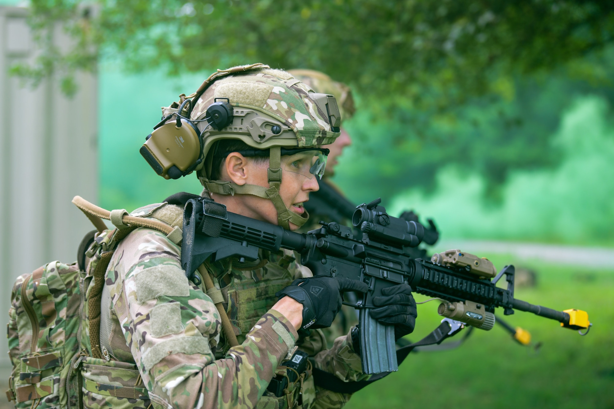 Tech. Sgt. Britney Simpson, an Integrated Defense Leadership Course student assigned to the 927th Security Forces Squadron, MacDill Air Force Base, Florida, leads her squad in an assault on an opposing force position during an area security operations exercise at Camp James A. Garfield Joint Military Training Center, Ohio, July 27, 2022.
