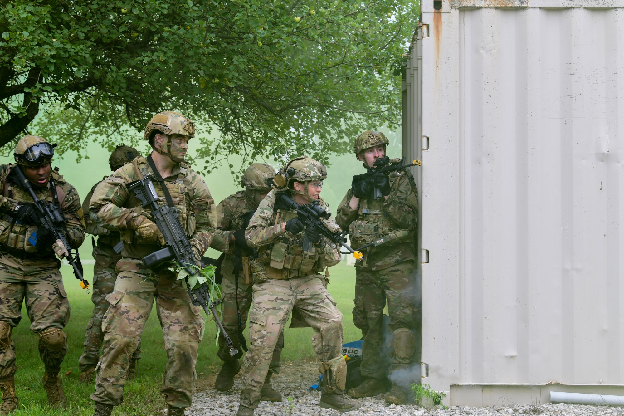 Integrated Defense Leadership Course students assigned to the 927th Security Forces Squadron, MacDill Air Force Base, Florida, prepare to move on a target during an area security operations exercise at Camp James A. Garfield Joint Military Training Center, Ohio, July 27, 2022.