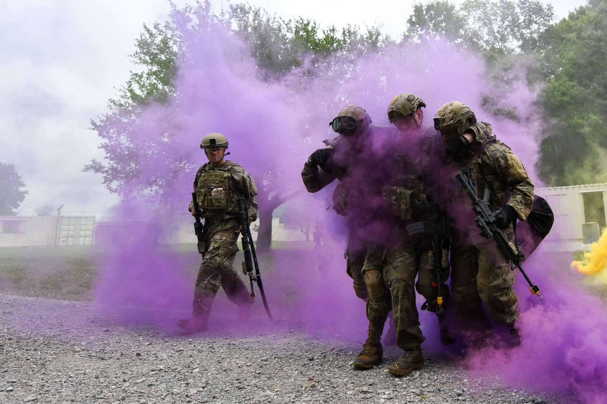 Integrated Defense Leadership Course students assigned to the 927th Security Forces Squadron, MacDill Air Force Base, Florida, assist a wingman with a simulated injury during an area security operations exercise at Camp James A. Garfield Joint Military Training Center, Ohio, July 27, 2022.