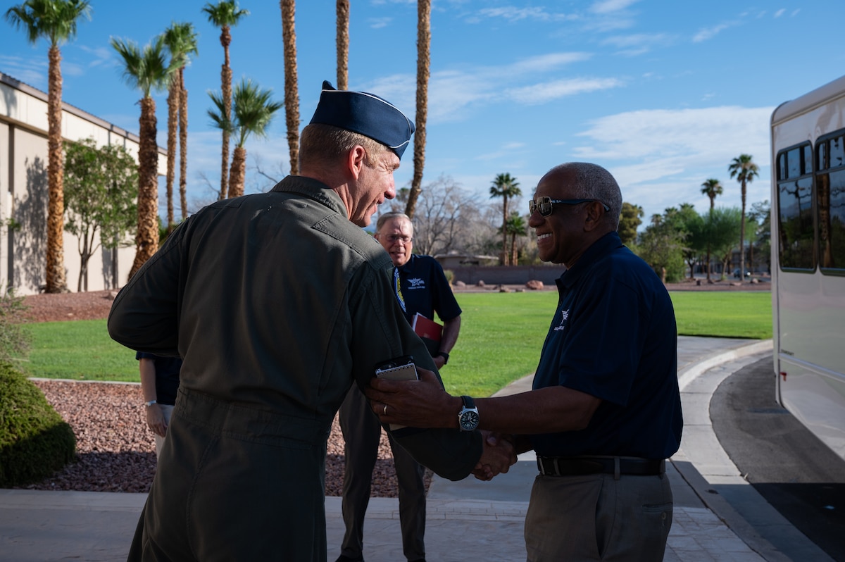 A man shaking hands with a General