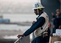 Chief Boatswain’s Mate Derval Davis, from Saint John, supervises aboard the Lewis B. Puller-class expeditionary sea base USS Hershel "Woody" Williams (ESB 4) as the ship pulls into port, July 29, 2022. Hershel “Woody” Williams is rotationally deployed to the U.S. Naval Forces Africa area of operations, employed by U.S. Sixth Fleet, to defend U.S., allied and partner interests.