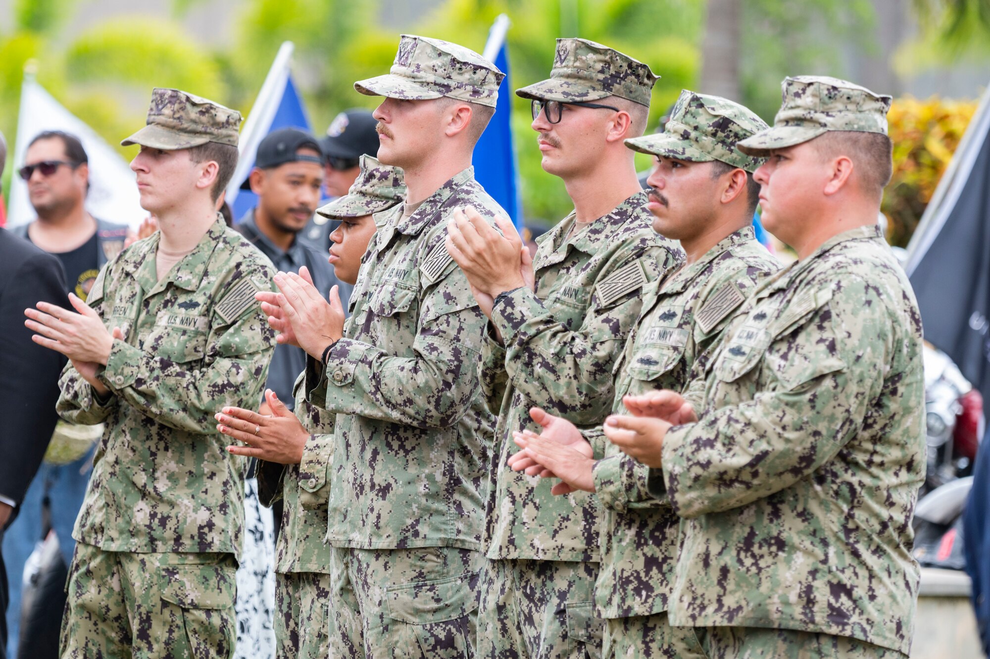 Sailors clapping their hands.