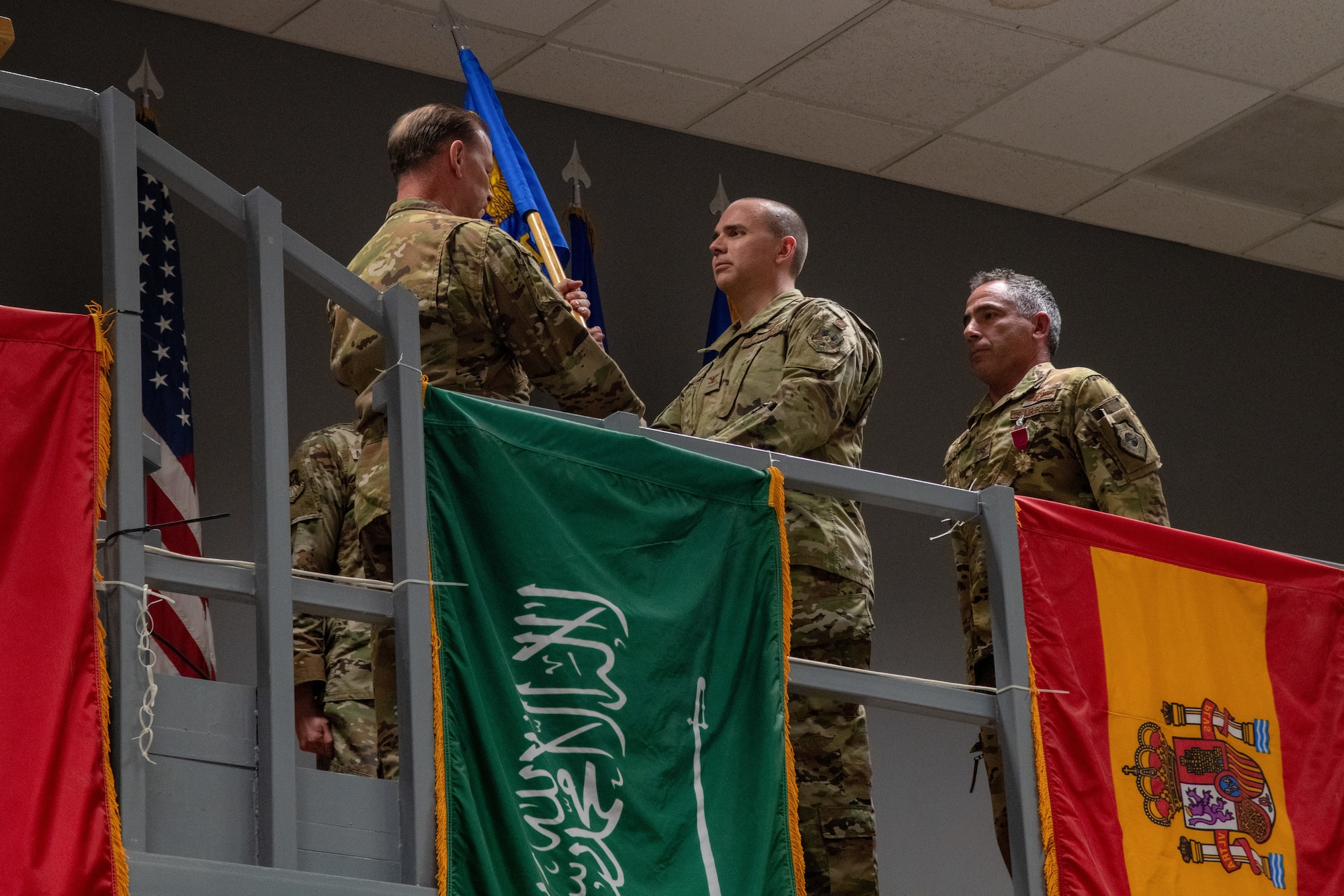 U.S. Air Force Maj. Gen. David Meyer, Deputy Commander, Ninth Air Force (Air Forces Central), presents the unit flag to U.S. Air Force Col. Kevin M. Ogle, as he assumes command of the 609th Air Operations Center, during the unit’s change of command ceremony at the Combined Air Operations Center at Al Udeid Air Base, Qatar, May 25, 2022. At the ceremony, U.S. Air Force Col. Joshua Koslov relinquished command of the 609th AOC to U.S. Air Force Col. Kevin M. Ogle. Ogle closed the ceremony with his vision for the future of the AOC, which included his desire to continue posturing to prevail tomorrow, deter regional aggressors, and the forge of resolute partnerships across the AFCENT area of responsibility. (U.S. Air Force photo by Senior Airman Dominic Tyler)