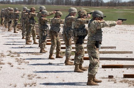 Soldiers fire pistols