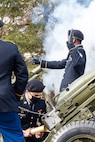 Soldier signals firing of howitzer