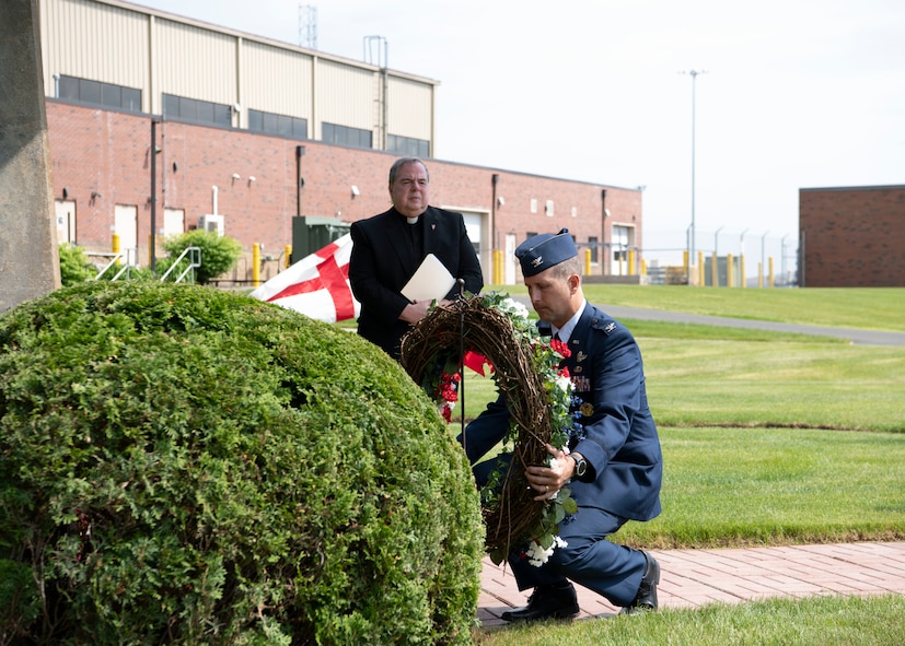 Barnestomers honor the 13 Airmen fallen in flight from the 104th Fighter Wing during the F-100 memorial rededication ceremony, May 20, 2022, at Barnes Air National Guard Base, Massachusetts. The F-100 monument was originally dedicated on May 17, 1987 by the 104FW Chief Master Sergeant’s Council. It continues to serve as a reminder of fallen Airmen’s impact on the unit.(U.S. Air National Guard photo by Staff Sgt. Hanna Smith)
