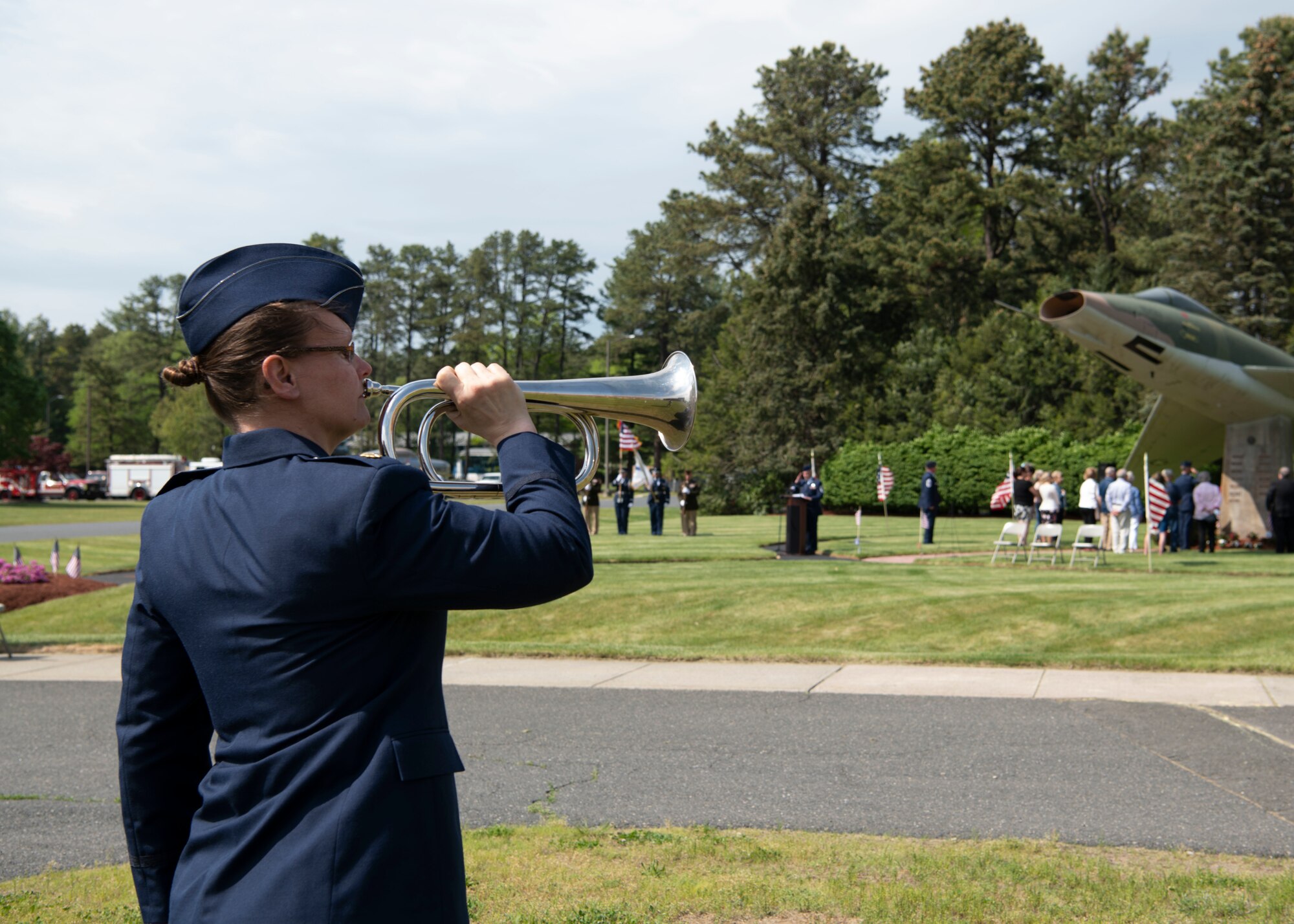 Barnestomers honor the 13 Airmen fallen in flight from the 104th Fighter Wing during the F-100 memorial rededication ceremony, May 20, 2022, at Barnes Air National Guard Base, Massachusetts. The F-100 monument was originally dedicated on May 17, 1987 by the 104FW Chief Master Sergeant’s Council. It continues to serve as a reminder of fallen Airmen’s impact on the unit.(U.S. Air National Guard photo by Staff Sgt. Hanna Smith)