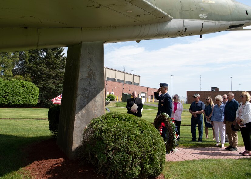 Barnestomers honor the 13 Airmen fallen in flight from the 104th Fighter Wing during the F-100 memorial rededication ceremony, May 20, 2022, at Barnes Air National Guard Base, Massachusetts. The F-100 monument was originally dedicated on May 17, 1987 by the 104FW Chief Master Sergeant’s Council. It continues to serve as a reminder of fallen Airmen’s impact on the unit.(U.S. Air National Guard photo by Staff Sgt. Hanna Smith)