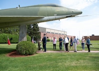 Barnestomers honor the 13 Airmen fallen in flight from the 104th Fighter Wing during the F-100 memorial rededication ceremony, May 20, 2022, at Barnes Air National Guard Base, Massachusetts. The F-100 monument was originally dedicated on May 17, 1987 by the 104FW Chief Master Sergeant’s Council. It continues to serve as a reminder of fallen Airmen’s impact on the unit.(U.S. Air National Guard photo by Staff Sgt. Hanna Smith)