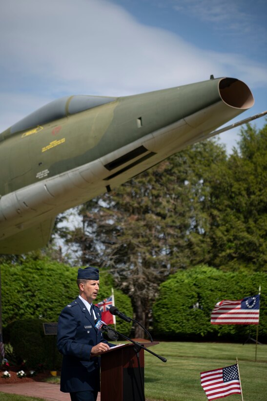 Barnestomers honor the 13 Airmen fallen in flight from the 104th Fighter Wing during the F-100 memorial rededication ceremony, May 20, 2022, at Barnes Air National Guard Base, Massachusetts. The F-100 monument was originally dedicated on May 17, 1987 by the 104FW Chief Master Sergeant’s Council. It continues to serve as a reminder of fallen Airmen’s impact on the unit.(U.S. Air National Guard photo by Staff Sgt. Hanna Smith)