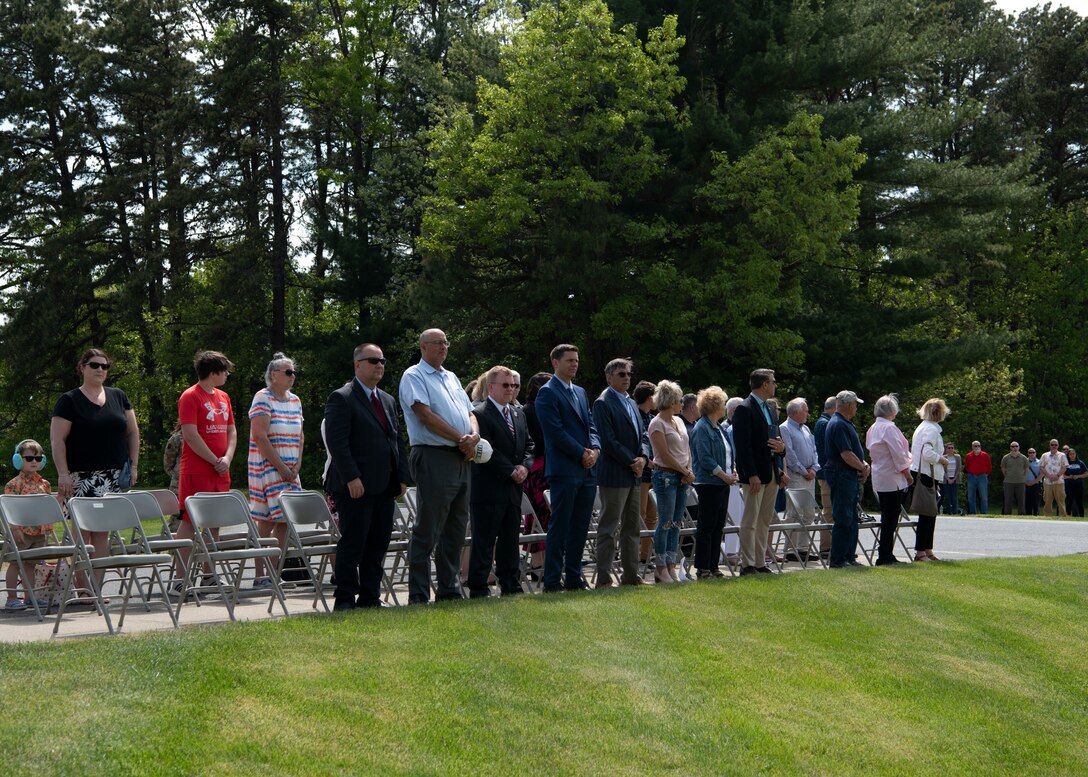 Barnestomers honor the 13 Airmen fallen in flight from the 104th Fighter Wing during the F-100 memorial rededication ceremony, May 20, 2022, at Barnes Air National Guard Base, Massachusetts. The F-100 monument was originally dedicated on May 17, 1987 by the 104FW Chief Master Sergeant’s Council. It continues to serve as a reminder of fallen Airmen’s impact on the unit.(U.S. Air National Guard photo by Staff Sgt. Hanna Smith)