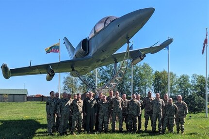 Brig. Gen. Michael Regan Jr., deputy adjutant general-air, Pennsylvania National Guard, and other Pennsylvania Air National Guard leaders pose for a photo with leaders from Lithuania's Šiauliai Air Base May 24, 2022. The Pennsylvania National Guard and Lithuania are partners under the Department of Defense National Guard Bureau State Partnership Program.