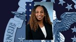 Portrait of female sitting in front of American flag.