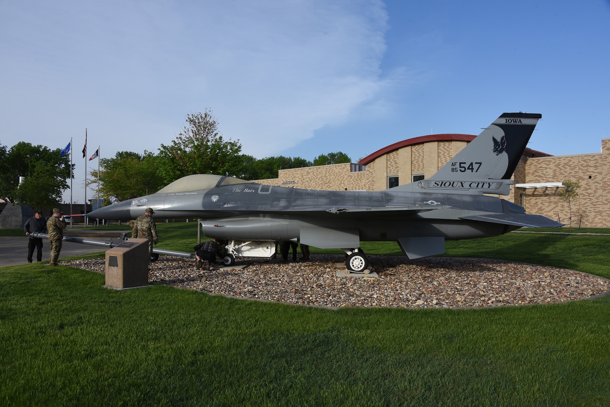 A U.S. Air Force F-16 is removed from static display and moved to paint facility.