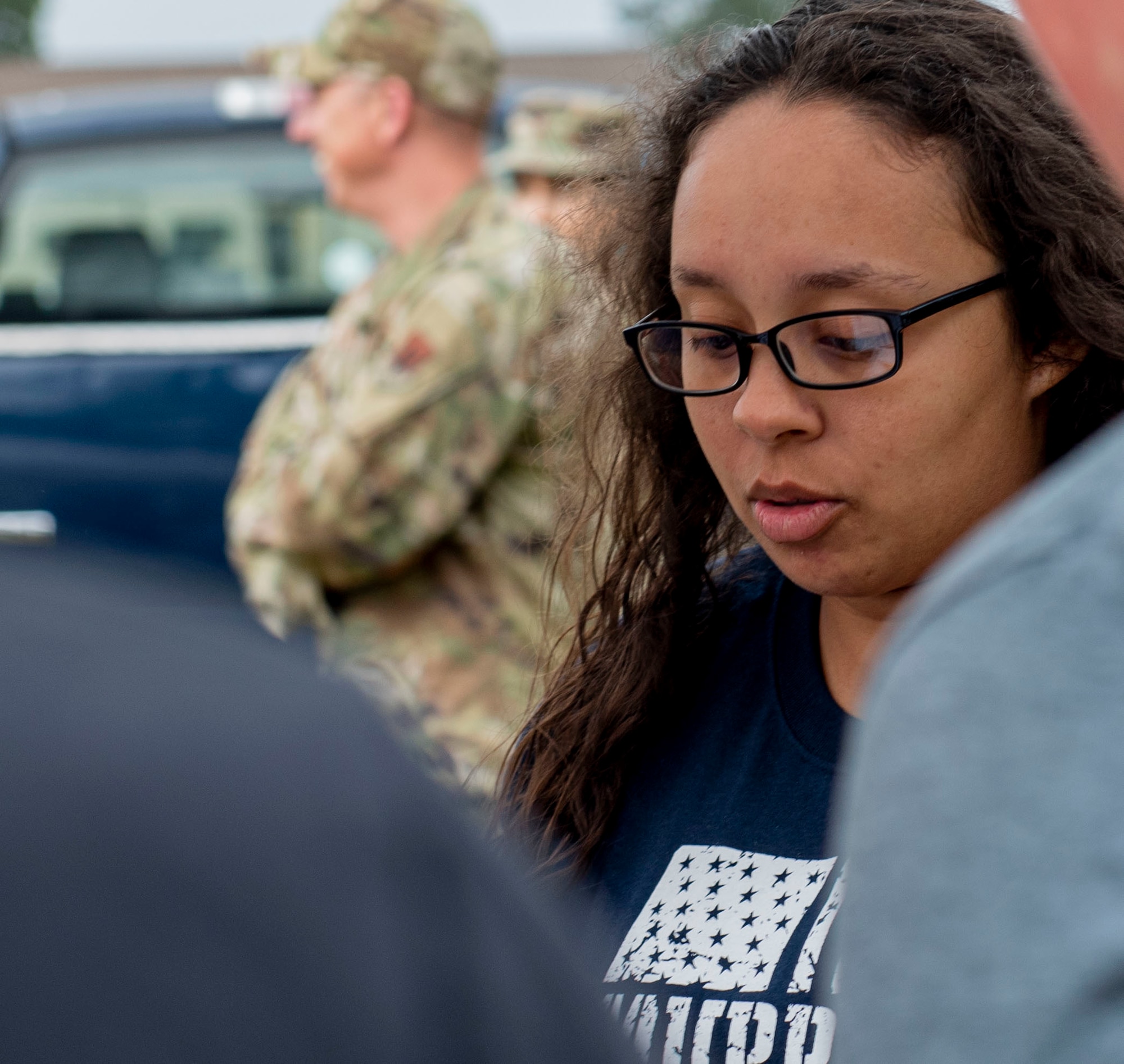 Airman 1st Class Jada Rush, 4th Force Support Squadron fitness specialist, registers Airmen, civilians and veterans for a Murph Challenge at Seymour Johnson Air Force Base, North Carolina, May 26, 2022. The Murph Challenge is hosted in memory of Lt. Michael Murphy, U.S. Navy Seal, who was killed in action, but while he was served, he completed this workout to stay physically fit. (U.S. Air Force photo by Airman 1st Class Sabrina Fuller)