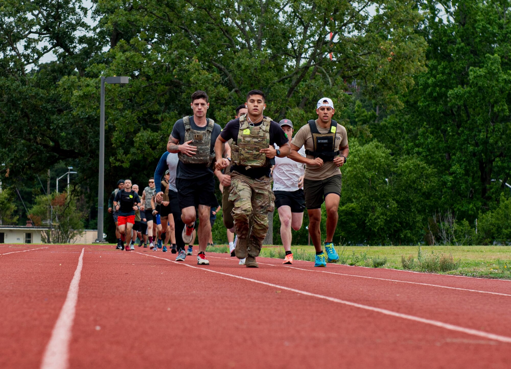 Airmen assigned to the 4th Fighter Wing, civilians and veterans participate in a one-mile run during a Murph Challenge at Seymour Johnson Air Force Base, North Carolina, May 26, 2022. The Murph Challenge consisted of a one mile run, 100 pull-ups, 300 squats, 100 push-ups and a second one-mile run. (U.S. Air Force photo by Airman 1st Class Sabrina Fuller)