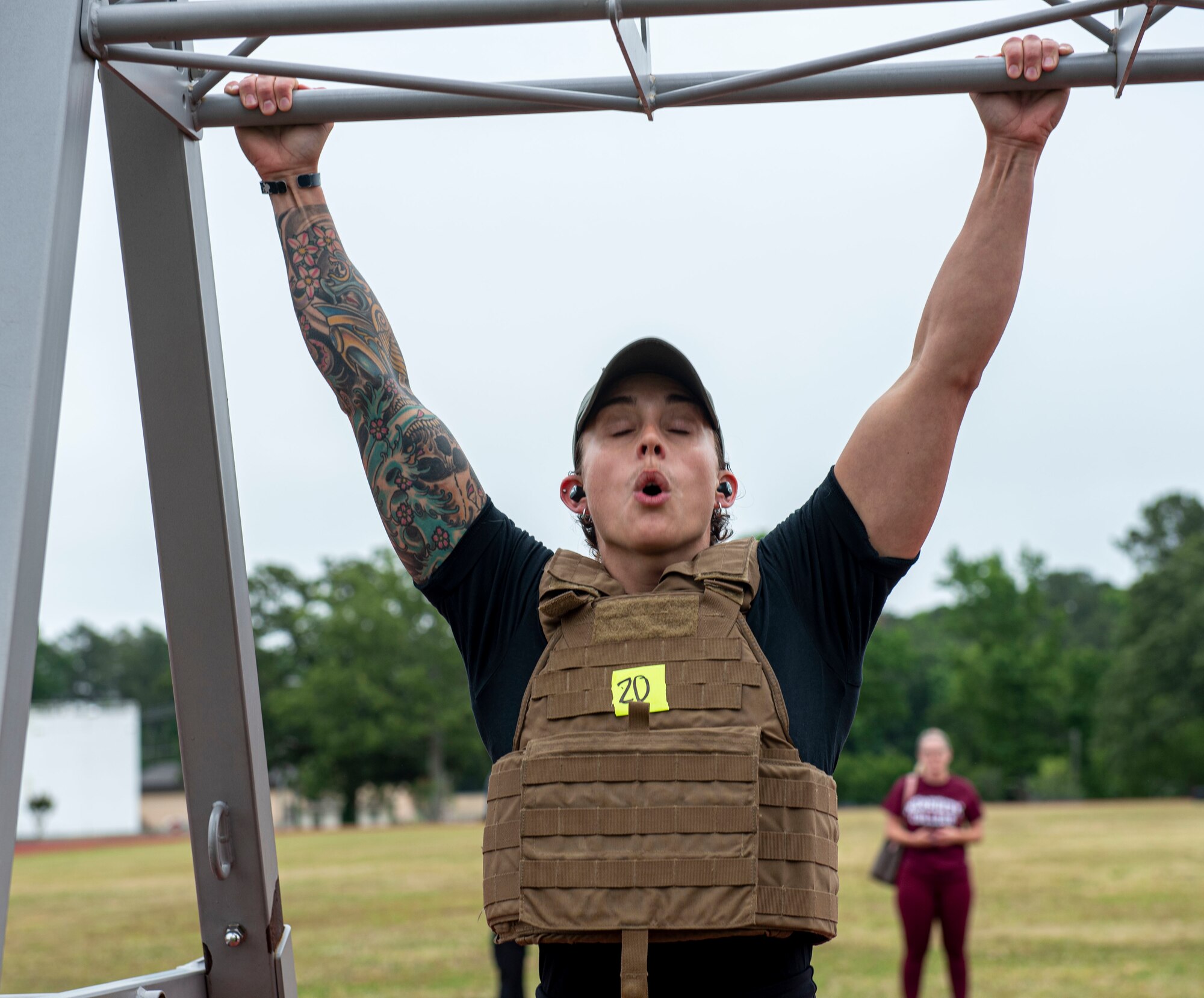 Kaitlin Martinez, U.S. Marine Corps veteran, completed 100 pull ups during a Murph Challenge at Seymour Johnson Air Force Base, North Carolina, May 26, 2022. Martinez finished first place overall with an approximate time of 32 minutes which consisted of the completion of a one-mile run, 100 pull-ups, 300 squats, 100 push-ups and a second one-mile run. (U.S. Air Force photo by Airman 1st Class Sabrina Fuller)