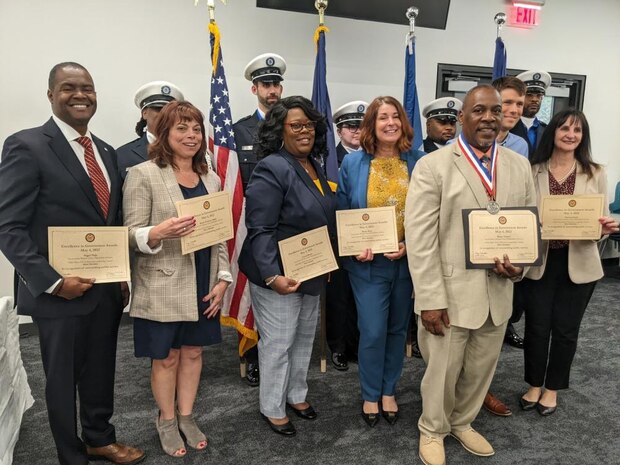 Employees receiving awards at Many Voices Ceremony