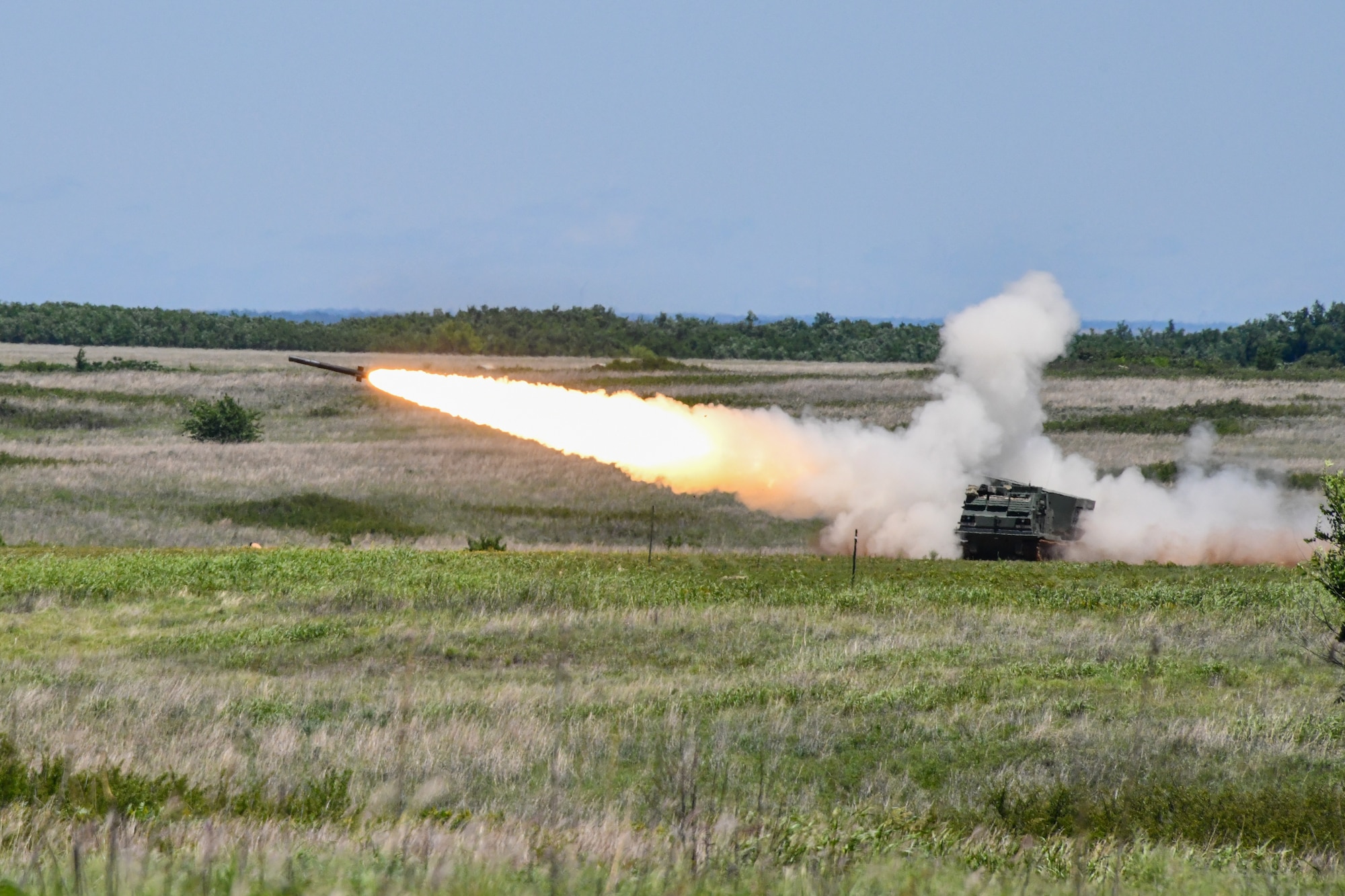 An M142 High Mobility Artillery Rocket System (HIMARS) fires a rocket for training at Fort Sill, Oklahoma, May 26, 2022. The HIMARS can fire precision-strike missiles up to 310 miles and other rockets up to 190 miles. (U.S. Air Force photo by Airman 1st Class Miyah Gray)