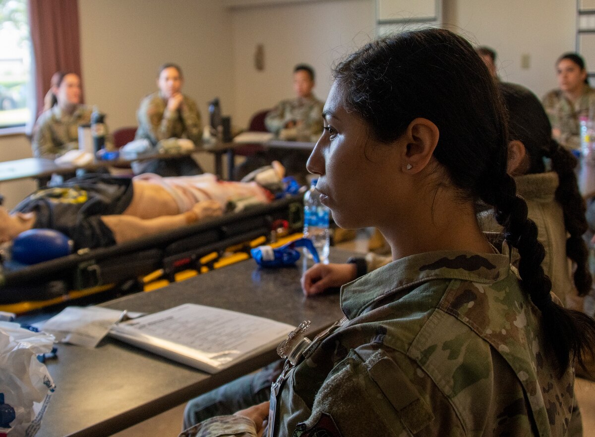 U.S. Air Force Airman 1st Class Briana Esqueda, 60th Dental Squadron dental assistant, listens to a lecture during tactical combat casualty care training at David Grant USAF Medical Center, Travis Air Force Base, California, April 28, 2022.