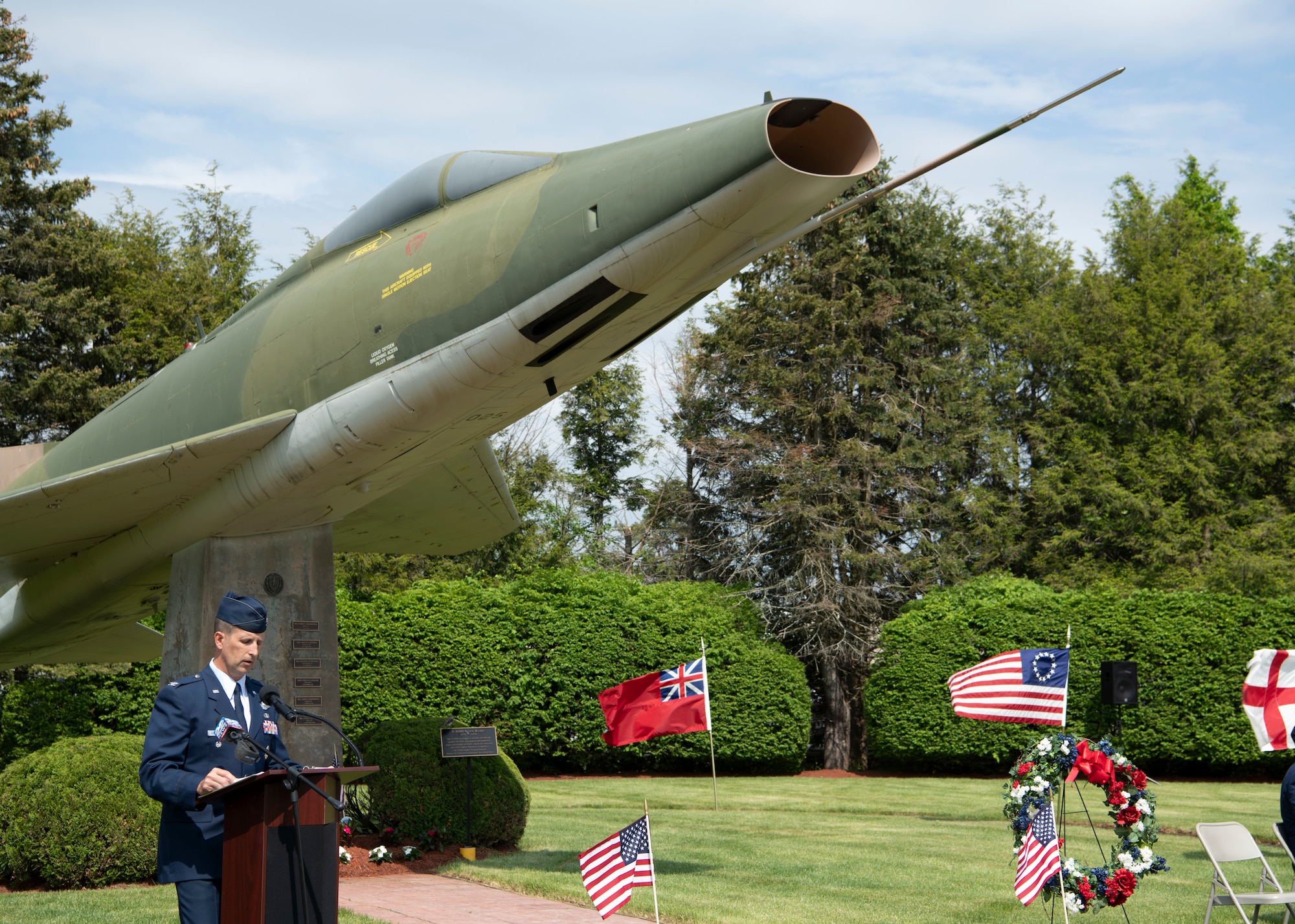 Barnestomers honor the 13 Airmen fallen in flight from the 104th Fighter Wing during the F-100 memorial rededication ceremony, May 20, 2022, at Barnes Air National Guard Base, Massachusetts. The F-100 monument was originally dedicated on May 17, 1987 by the 104FW Chief Master Sergeant’s Council. It continues to serve as a reminder of fallen Airmen’s impact on the unit.(U.S. Air National Guard photo by Staff Sgt. Hanna Smith)