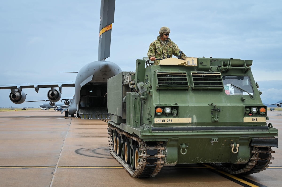 Soldiers load an M142 High Mobility Artillery Rocket System (HIMARS) onto a C-17 Globemaster III at Altus Air Force, Oklahoma, May 25, 2022. HIMARS is a light multiple rocket launcher developed in the late 1990s, mounted on a M1140 truck frame. (U.S. Air Force photo by Senior Airman Kayla Christenson)