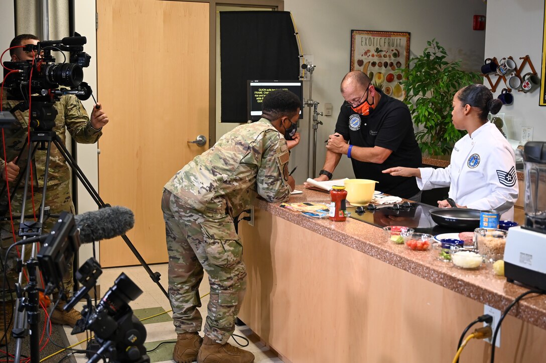 Image of Airmen working in a TV studio.