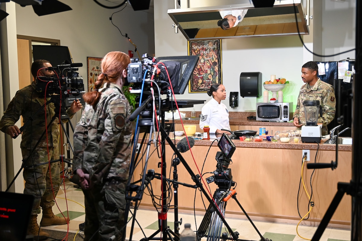 Image of Airmen working in a TV studio.