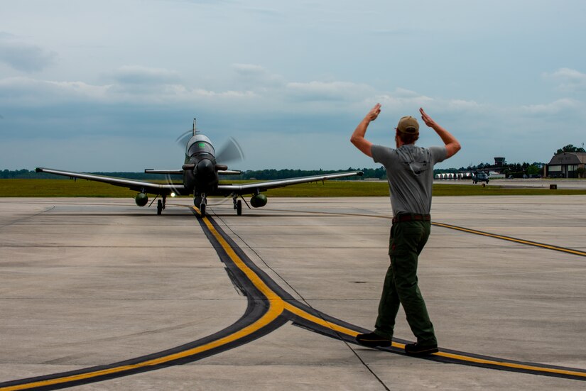 An AT-6E Wolverine taxis down the runway at Moody Air Force Base, Georgia, April 14, 2022. The experimentation flight focused on digitally tracking friendly forces and potential enemy movement using Airborne Extensible Relay Over-Horizon Network software.  (U.S. Air Force photo by Airman 1st Class Courtney Sebastianelli)
