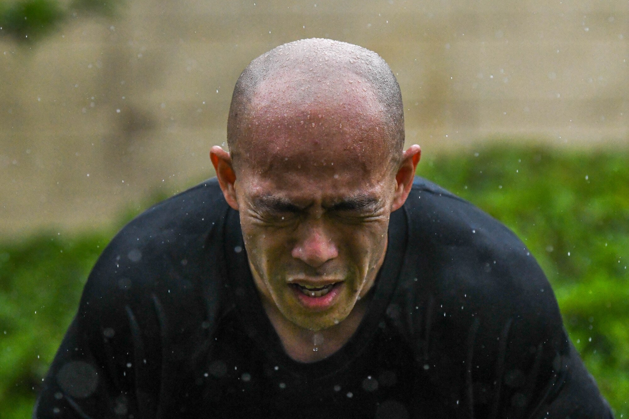 Eric Inafuku, Japan Field Office staff officer, performs a squat during a Murph challenge, at Yokota Air Base, Japan, May 27, 2022. The Murph challenge memorializes U.S. Navy SEAL Lt. Michael P. Murphy who received the Medal of Honor for his actions during the war in Afghanistan. He was the first member of the U.S. Navy to receive the award since the Vietnam War. (U.S. Air Force photo by Staff Sgt. Jessica Avallone)